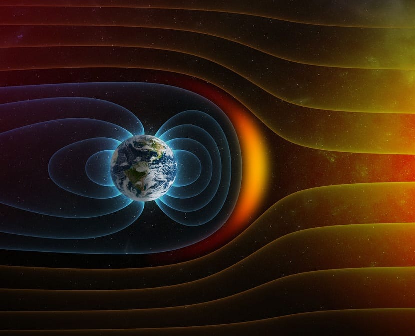 Representación visual del campo magnético de la Tierra interactuando con el viento solar